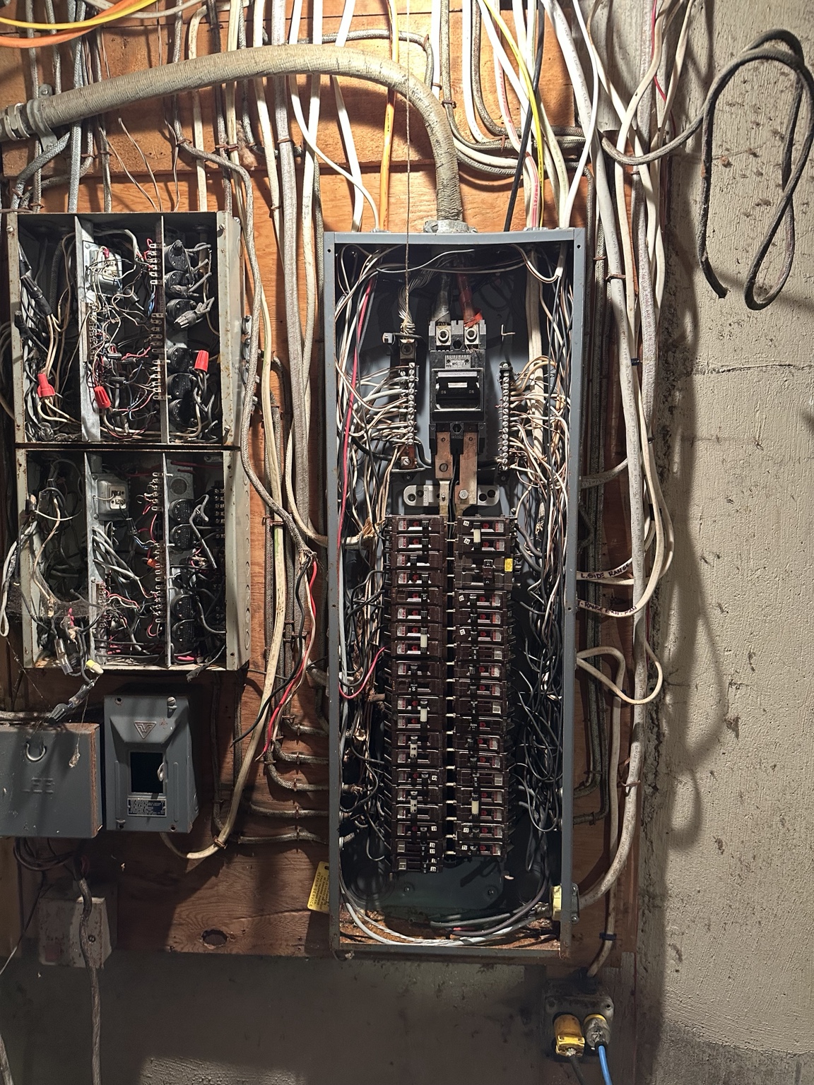 Older residential electrical panel before service upgrade